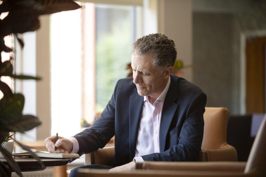 Photo of a Business mentor working on a written project for a client