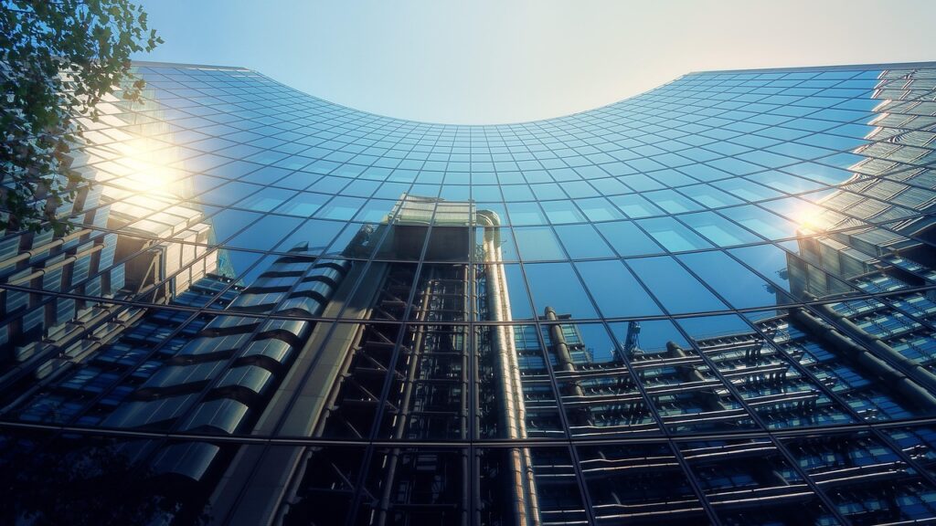 Photo of Willis Building London with reflection of Lloyds Building - Reflection is a key skill in Business mentoring