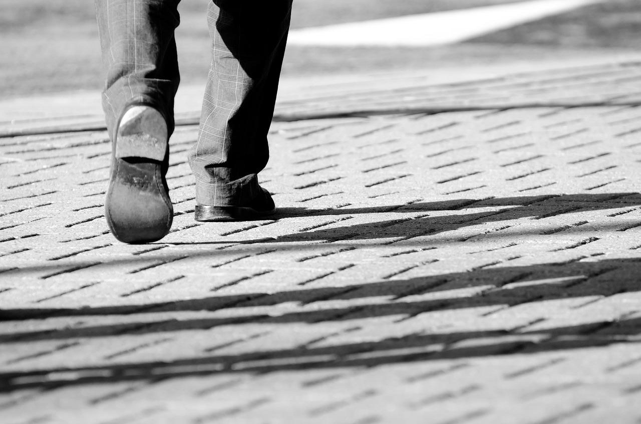 Business man walking alone: You can be more effective an efficient when you have people you can talk to and bounce ideas off.