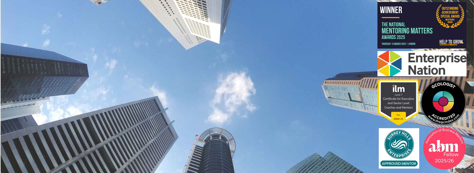 Image of London sky scrappers look up to the sky with logos on right hand side of Winning National Mentoring Award, Mentor for Enterprise Nation, ILM 7 Certificate in Mentoring and Coaching, GC Index Accreditation, Surrey Hills Enterprises Approved Mentor, ABM Fellow 25-26
