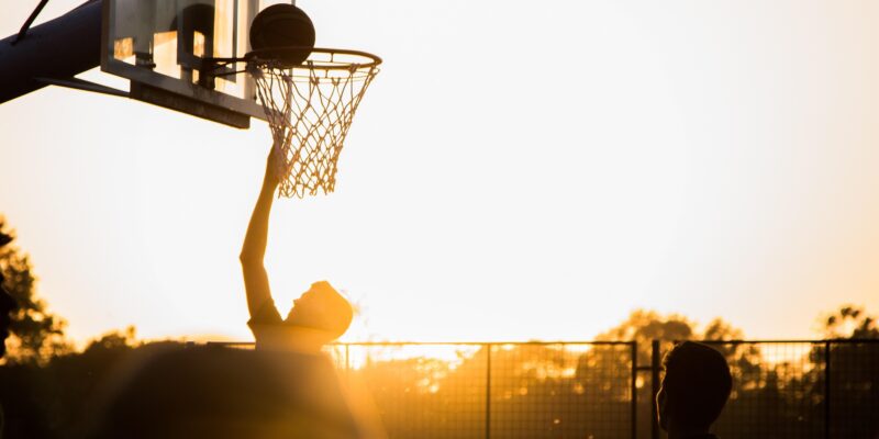 Basketball shot near hoop: You need to shoot for your goals otherwise you guarantee to miss them.