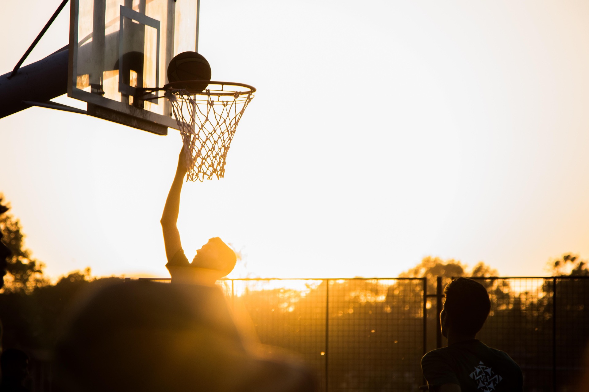 Basketball shot near hoop: You need to shoot for your goals otherwise you guarantee to miss them.
